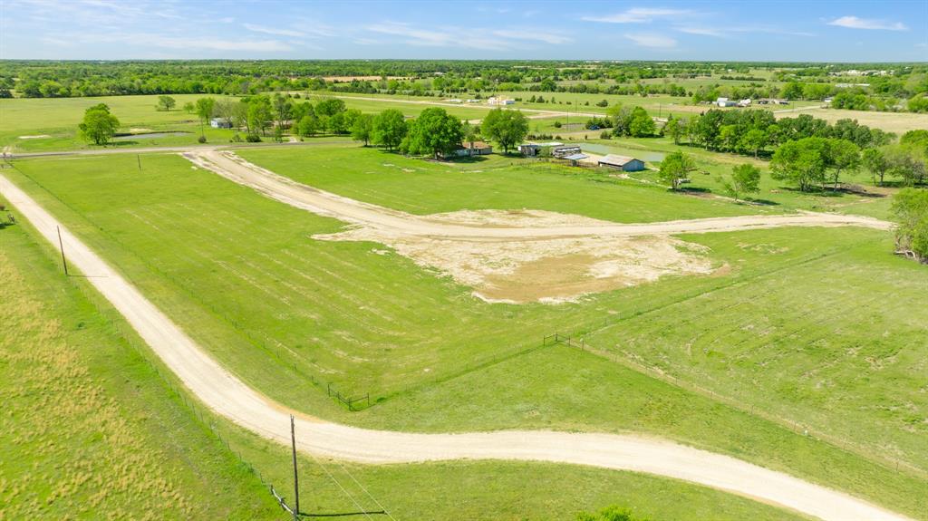 130 Private Road Sumner, TX 75486 - Photo 11 of 14 a view of a large swimming pool and a yard