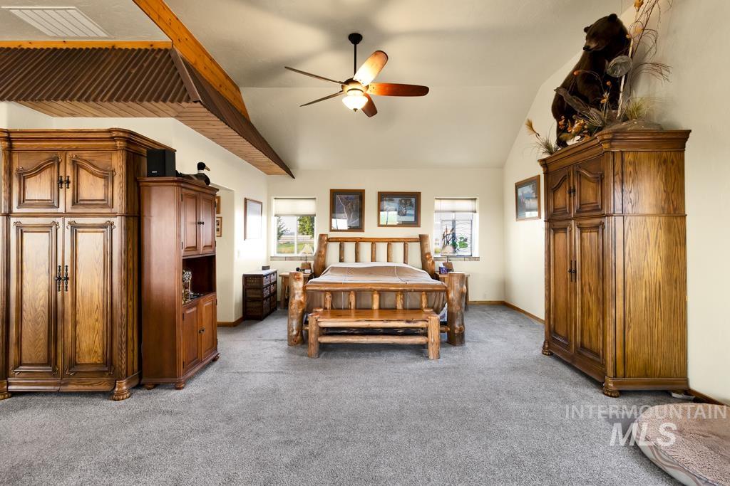 2530 4000 North Filer, ID 83328 - Photo 17 of 48 Bedroom with vaulted ceiling, light colored carpet, and ceiling fan