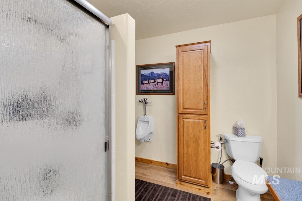 2530 4000 North Filer, ID 83328 - Photo 20 of 48 Full bathroom with a stall shower and wood finished floors