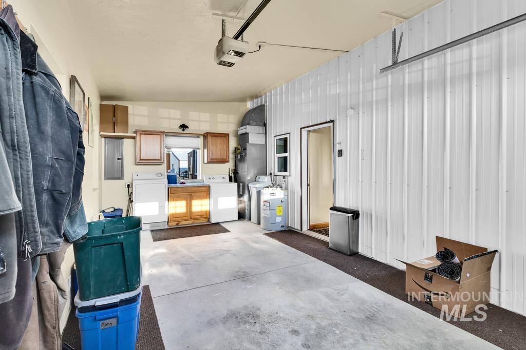 2530 4000 North Filer, ID 83328 - Photo 25 of 48 Garage with electric panel, independent washer and dryer, and a garage door opener