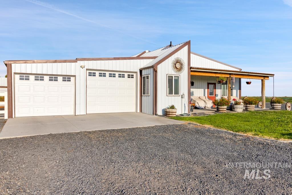 2530 4000 North Filer, ID 83328 - Photo 4 of 48 View of front of home featuring a porch, driveway, and a garage