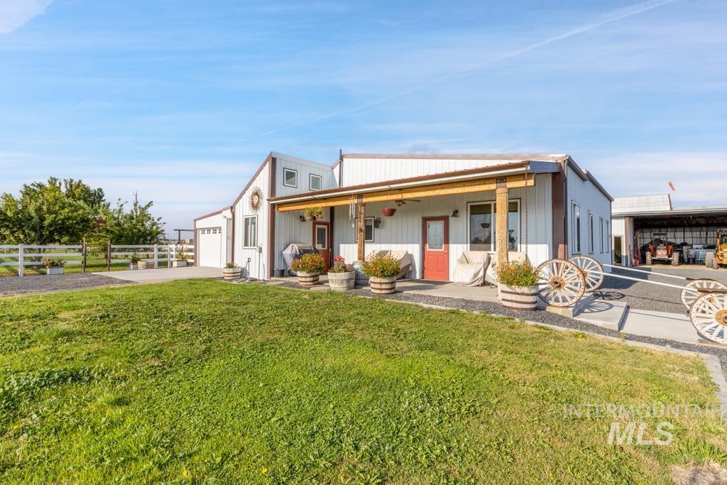2530 4000 North Filer, ID 83328 - Photo 5 of 48 View of front of home featuring a porch, driveway, and a garage