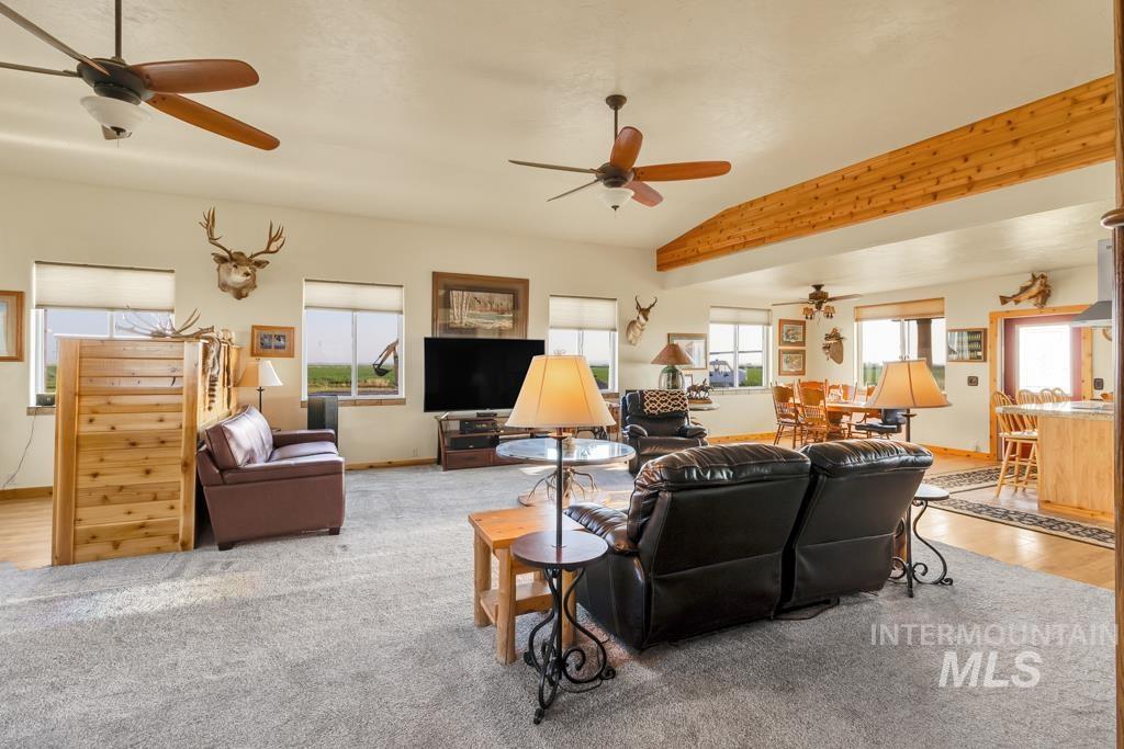 2530 4000 North Filer, ID 83328 - Photo 10 of 48 Living area with ceiling fan and light colored carpet