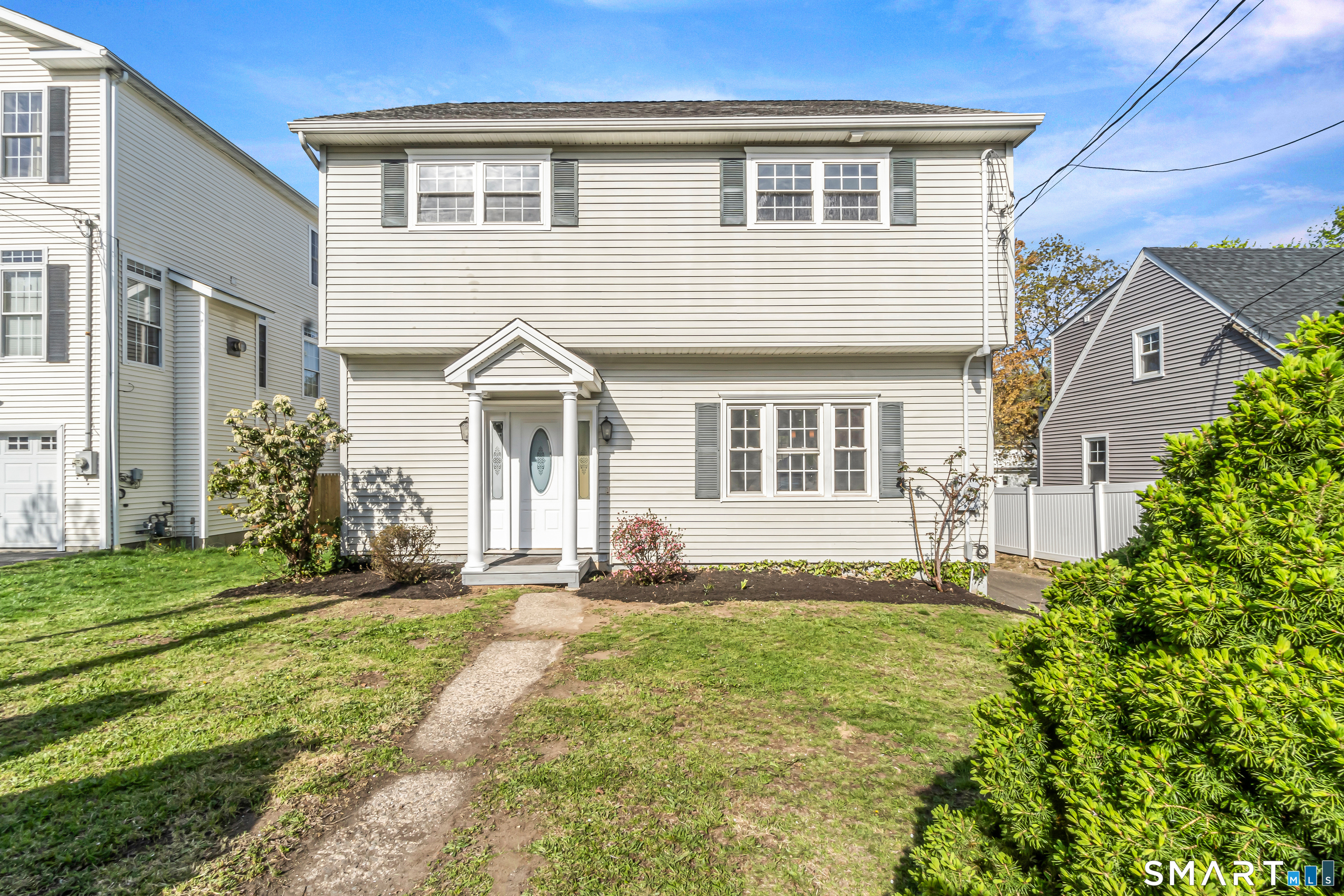 1770 Stratfield Road Fairfield, CT 06825 - Photo 1 of 40 a front view of a house with a yard