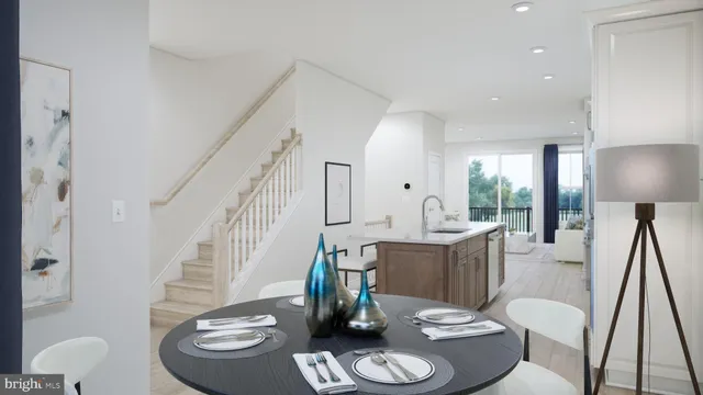 a dining room with furniture a rug and wooden floor
