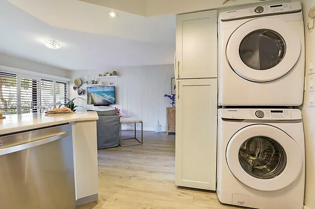 a view of a kitchen with washer and dryer