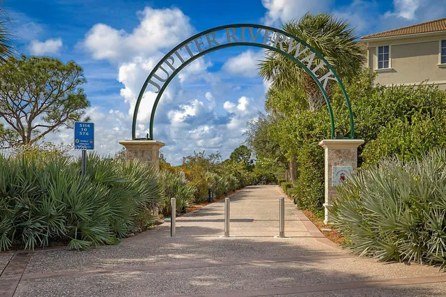 a view of a chair and table in the backyard