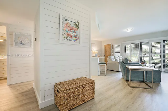 a living room with furniture rug and wooden floor