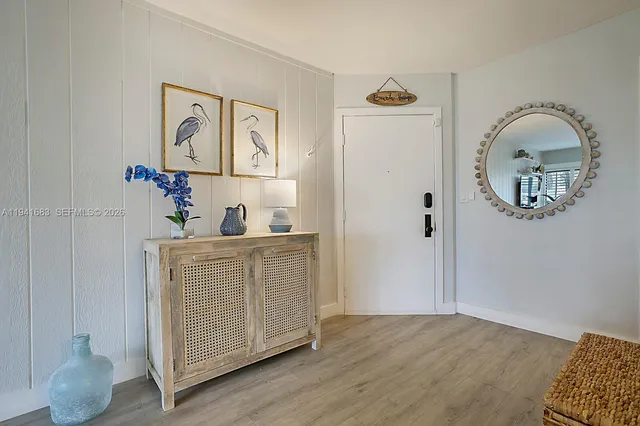 a view of living room and wooden floor