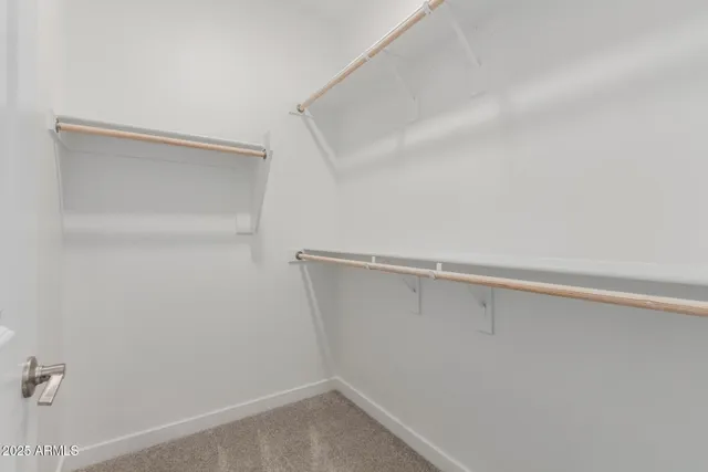 a view of an empty walk in closet