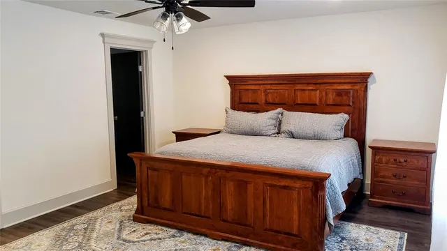 a bedroom with a bed and a dresser