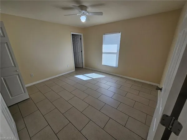 a view of an empty room and window