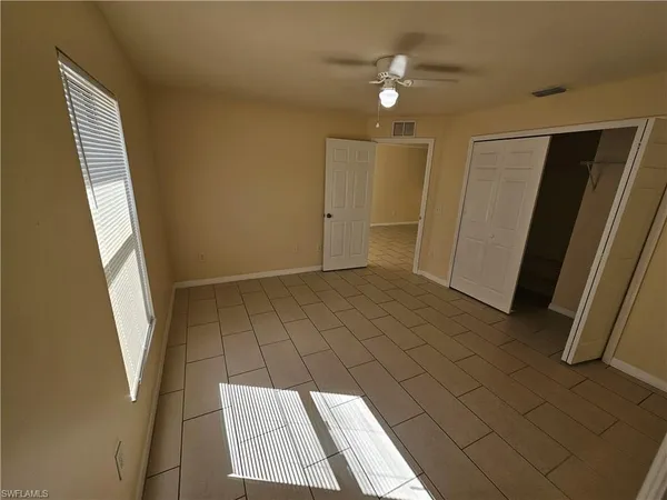 a view of an empty room and window