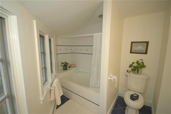 76 Holt Road Andover, MA 01810 - Photo 18 of 30 a bathroom with a tub and a shower