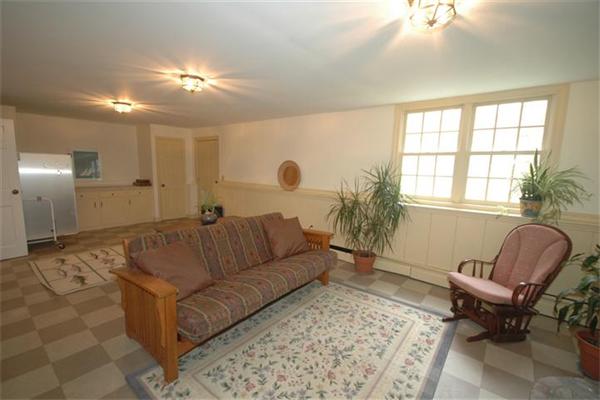 76 Holt Road Andover, MA 01810 - Photo 22 of 30 a living room with furniture and a large window