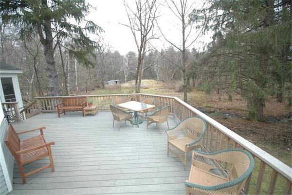 76 Holt Road Andover, MA 01810 - Photo 24 of 30 a view of a balcony with mountain view and wooden floor