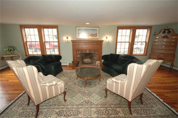 76 Holt Road Andover, MA 01810 - Photo 7 of 30 a living room with furniture and a fireplace
