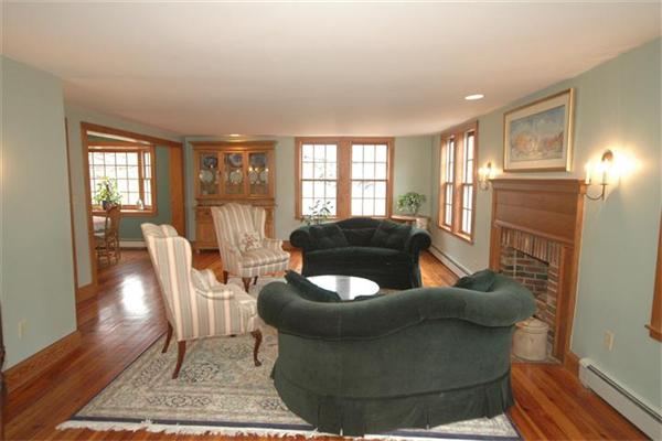 76 Holt Road Andover, MA 01810 - Photo 9 of 30 a living room with furniture and a potted plant