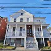 a front view of a house with a porch
