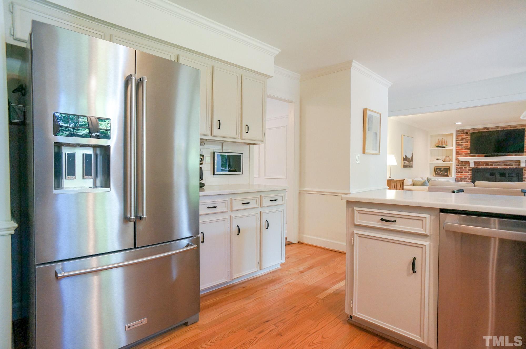 408 Emerywood Drive Raleigh, NC 27615 - Photo 15 of 44 a kitchen with stainless steel appliances a refrigerator stove and sink