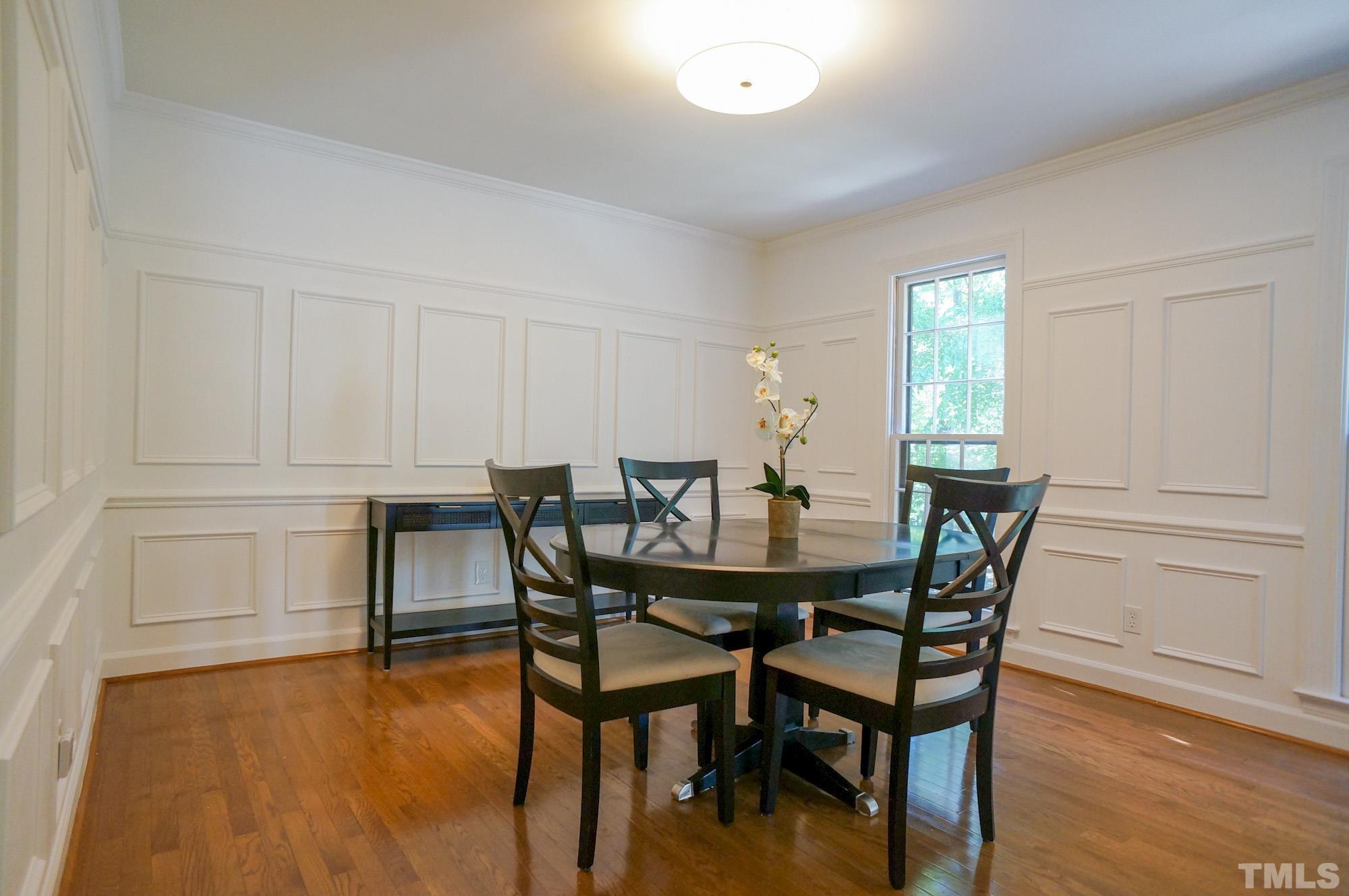 408 Emerywood Drive Raleigh, NC 27615 - Photo 19 of 44 a view of a dining room with furniture and wooden floor