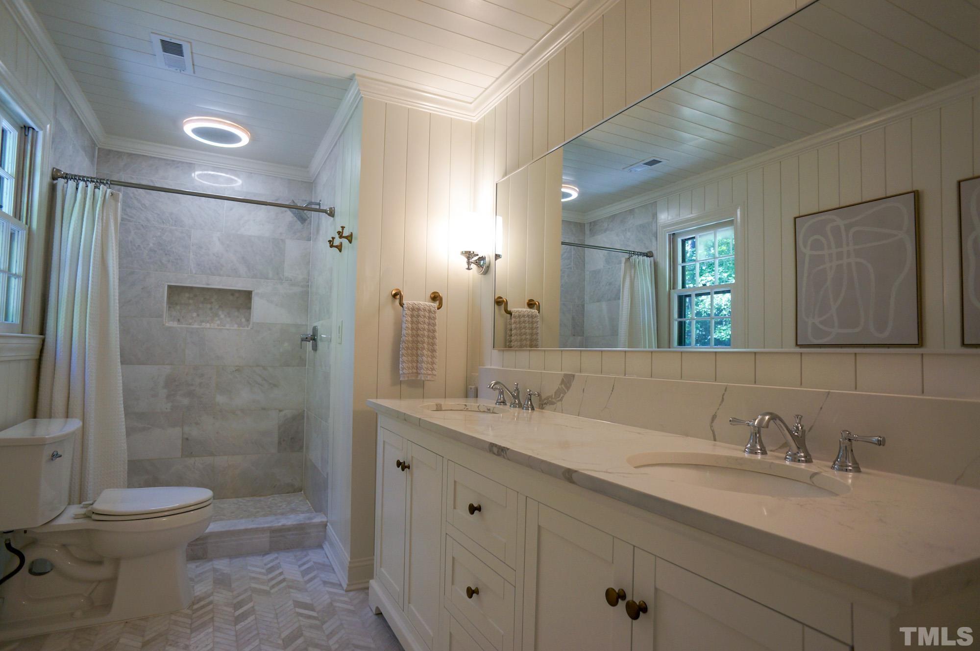 408 Emerywood Drive Raleigh, NC 27615 - Photo 23 of 44 a bathroom with a granite countertop sink toilet and shower