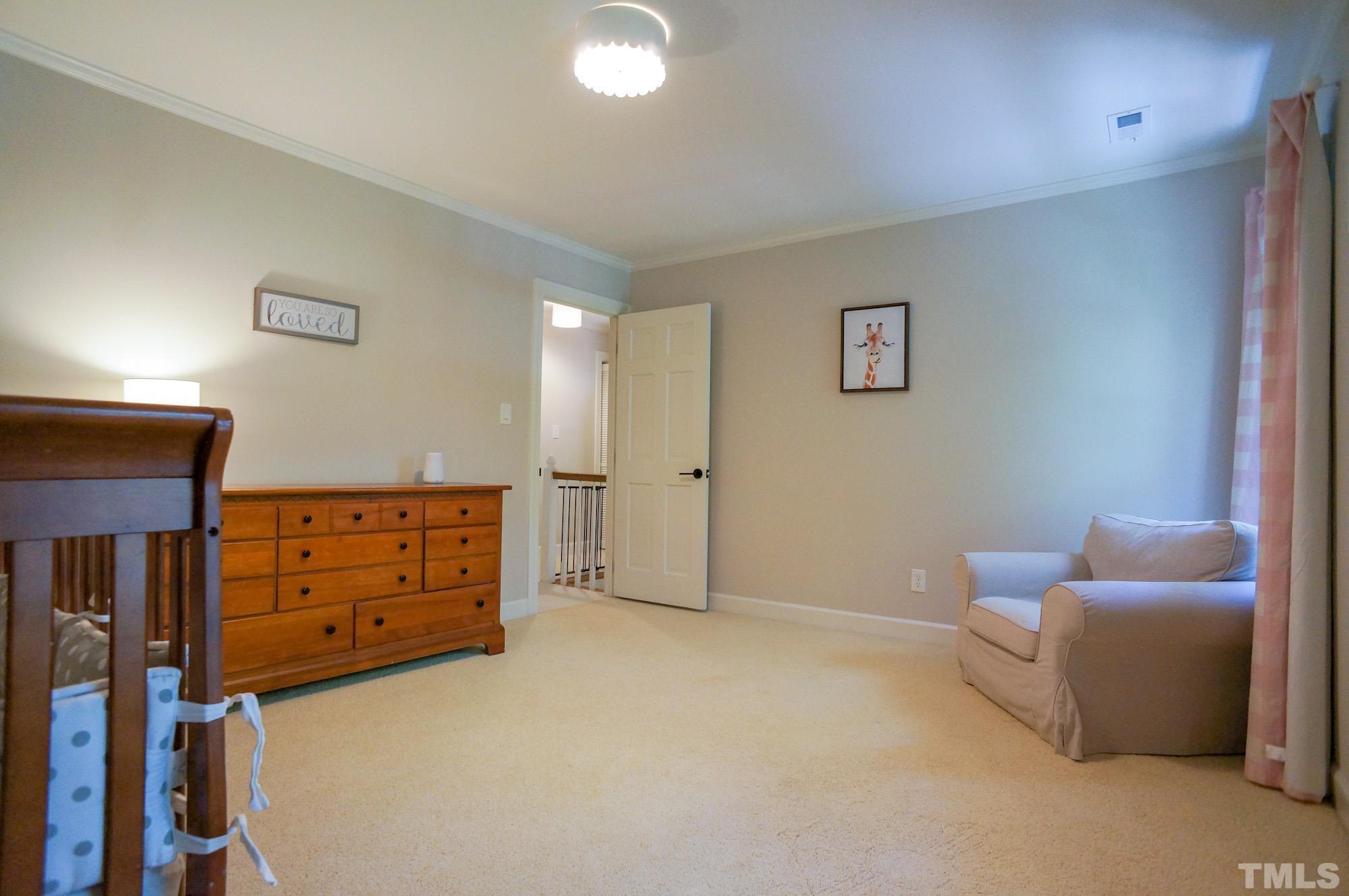 408 Emerywood Drive Raleigh, NC 27615 - Photo 25 of 44 a bedroom with furniture and a window