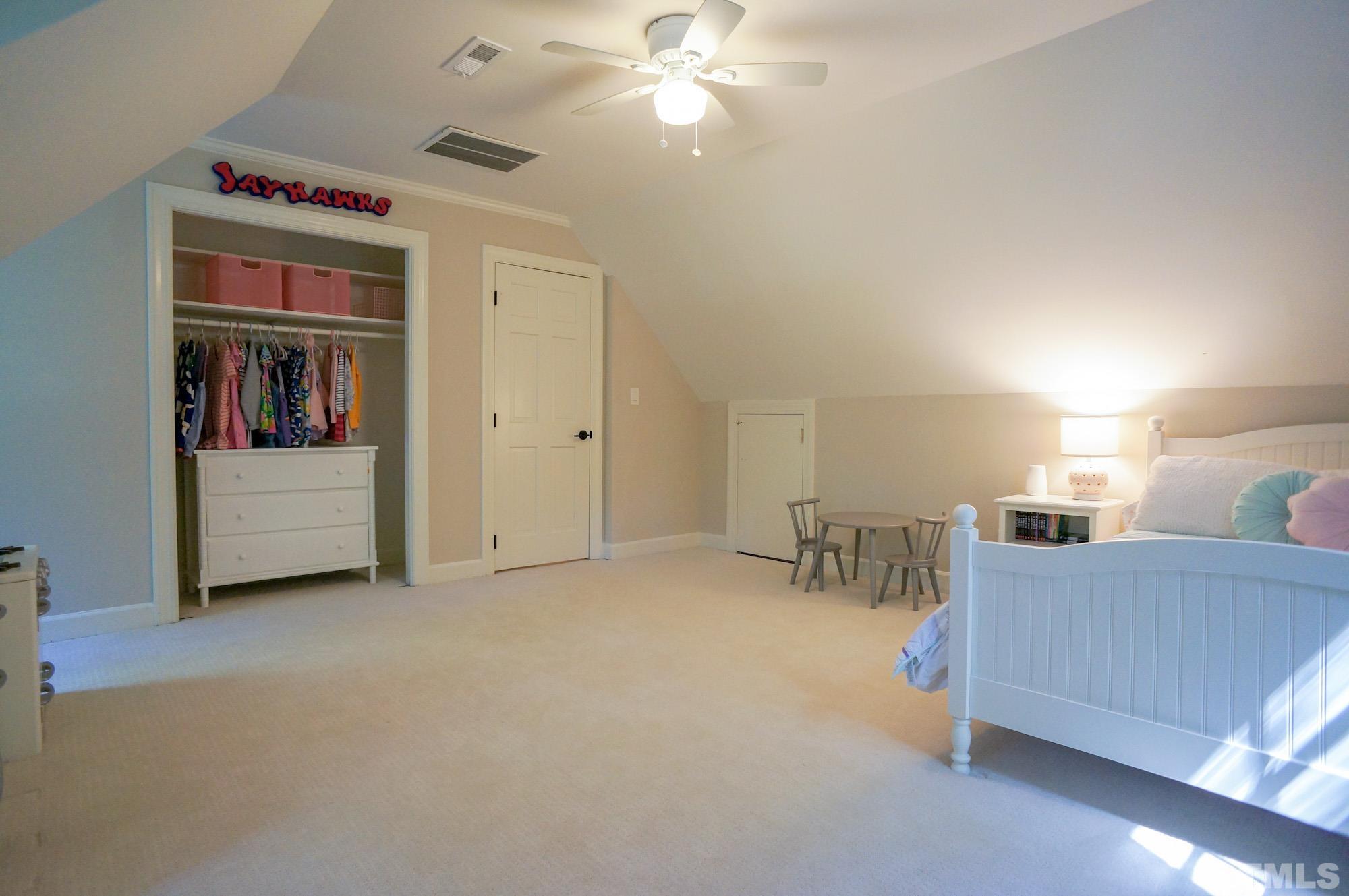 408 Emerywood Drive Raleigh, NC 27615 - Photo 30 of 44 a living room with furniture and a chandelier