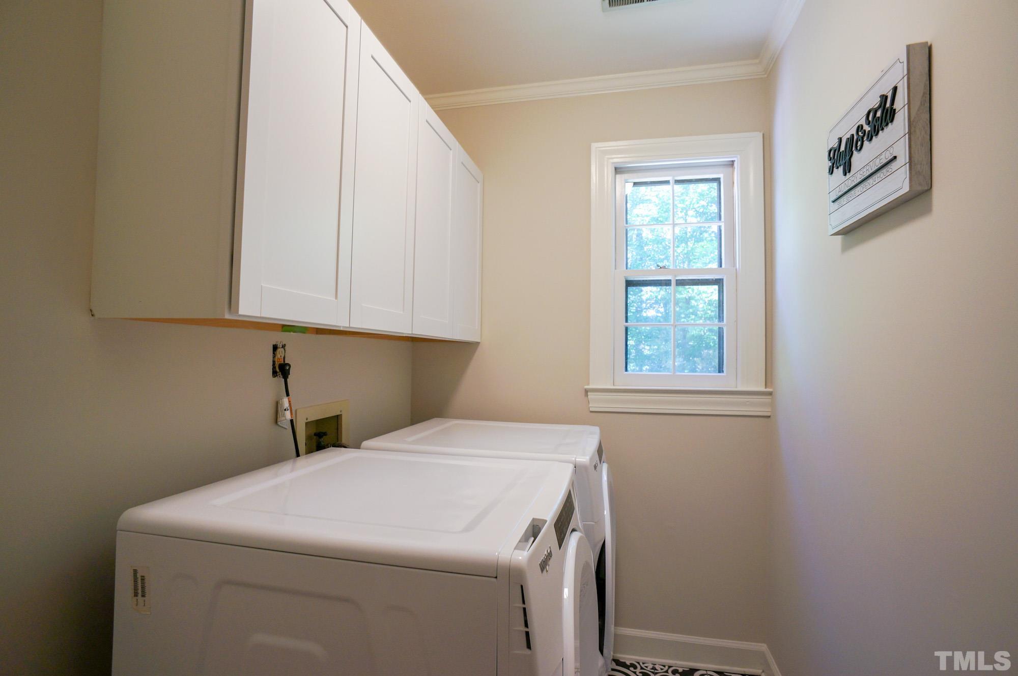 408 Emerywood Drive Raleigh, NC 27615 - Photo 32 of 44 a utility room with dryer and washer