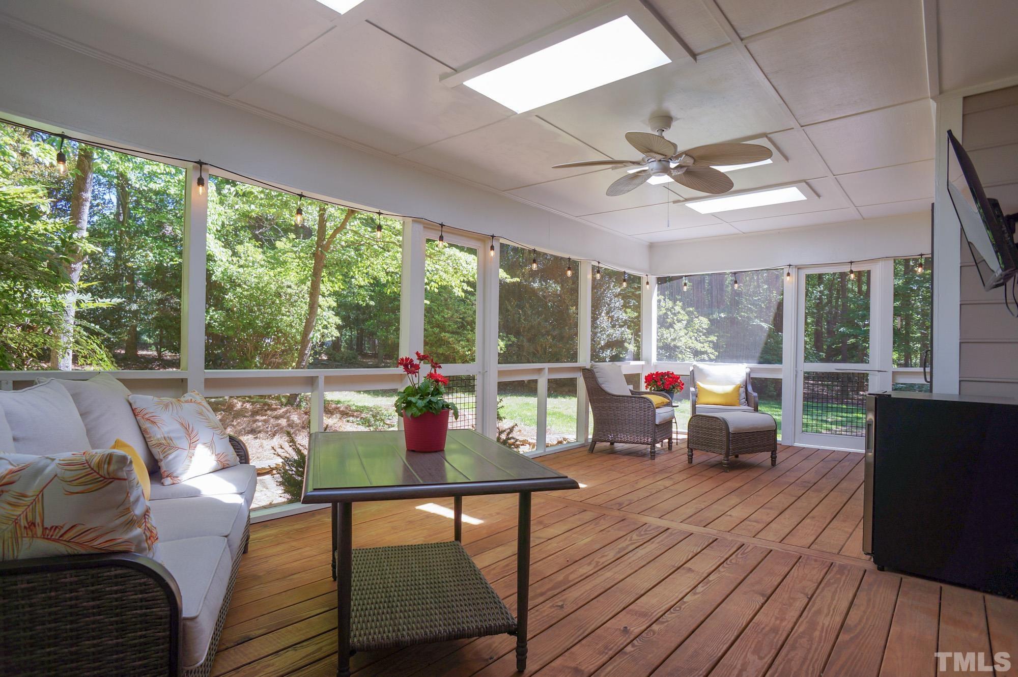 408 Emerywood Drive Raleigh, NC 27615 - Photo 33 of 44 a living room with furniture and a large window