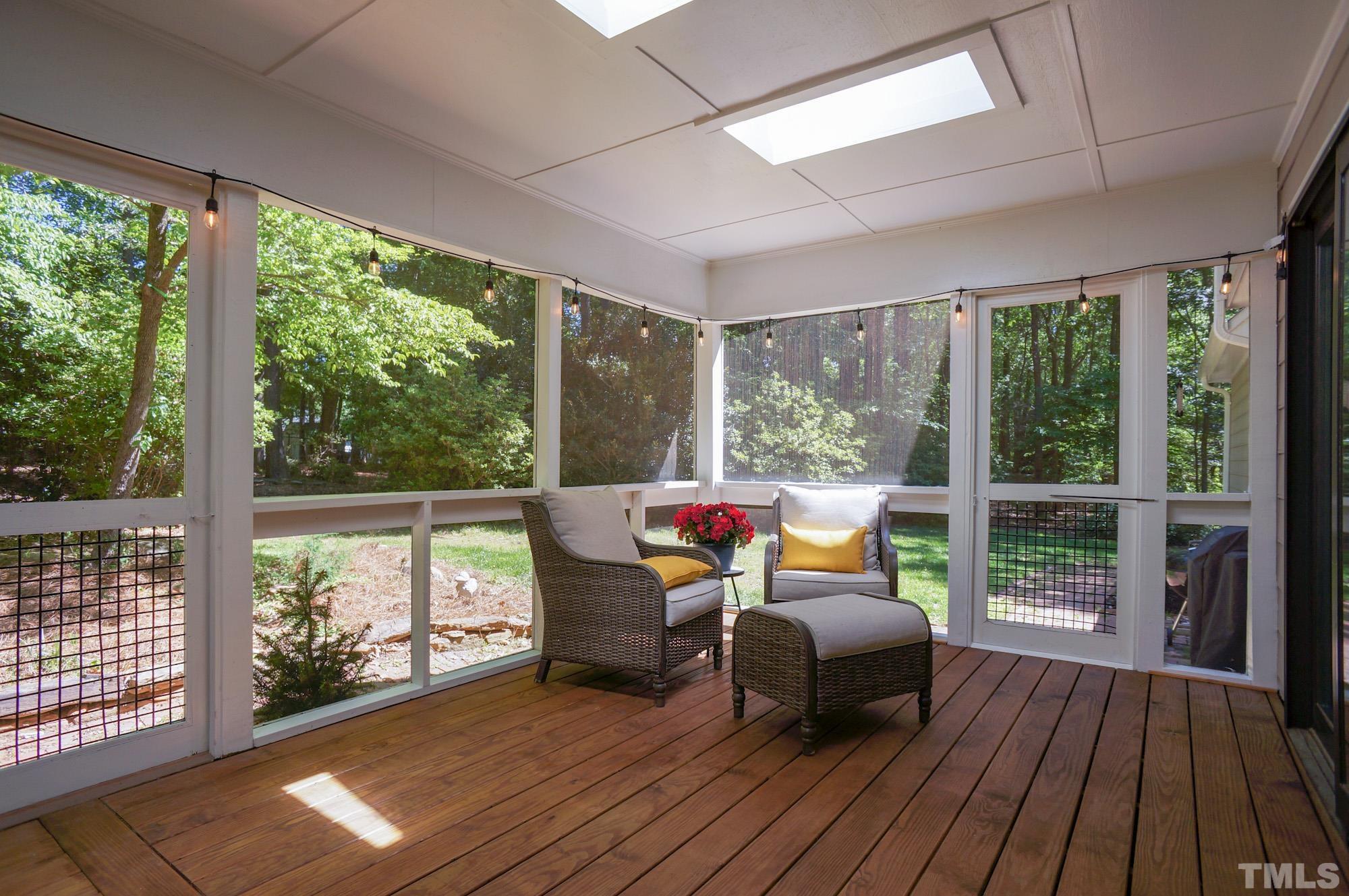 408 Emerywood Drive Raleigh, NC 27615 - Photo 34 of 44 a deck view with a seating space and hardwood floor