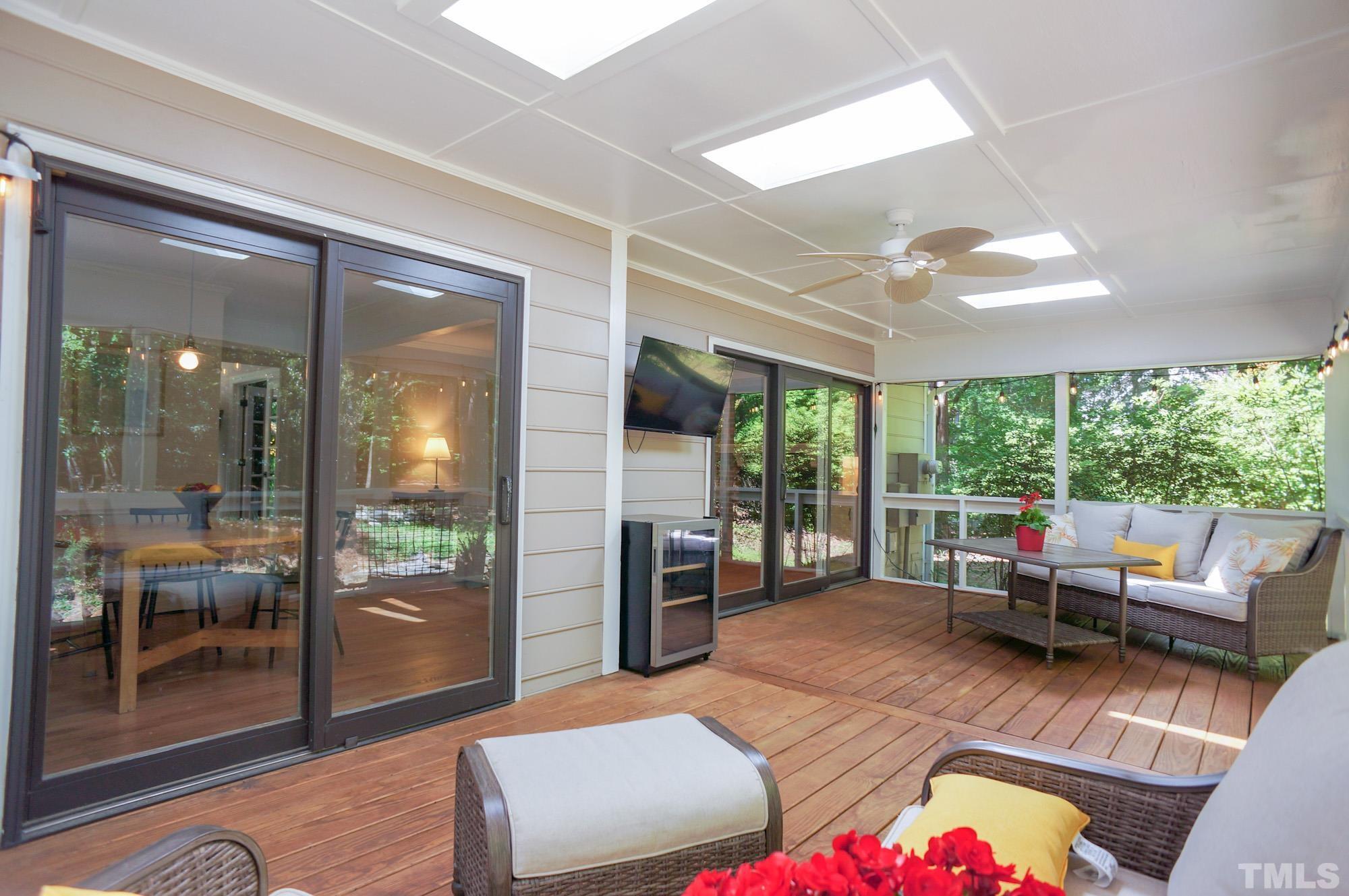 408 Emerywood Drive Raleigh, NC 27615 - Photo 35 of 44 a living room with furniture and a large window