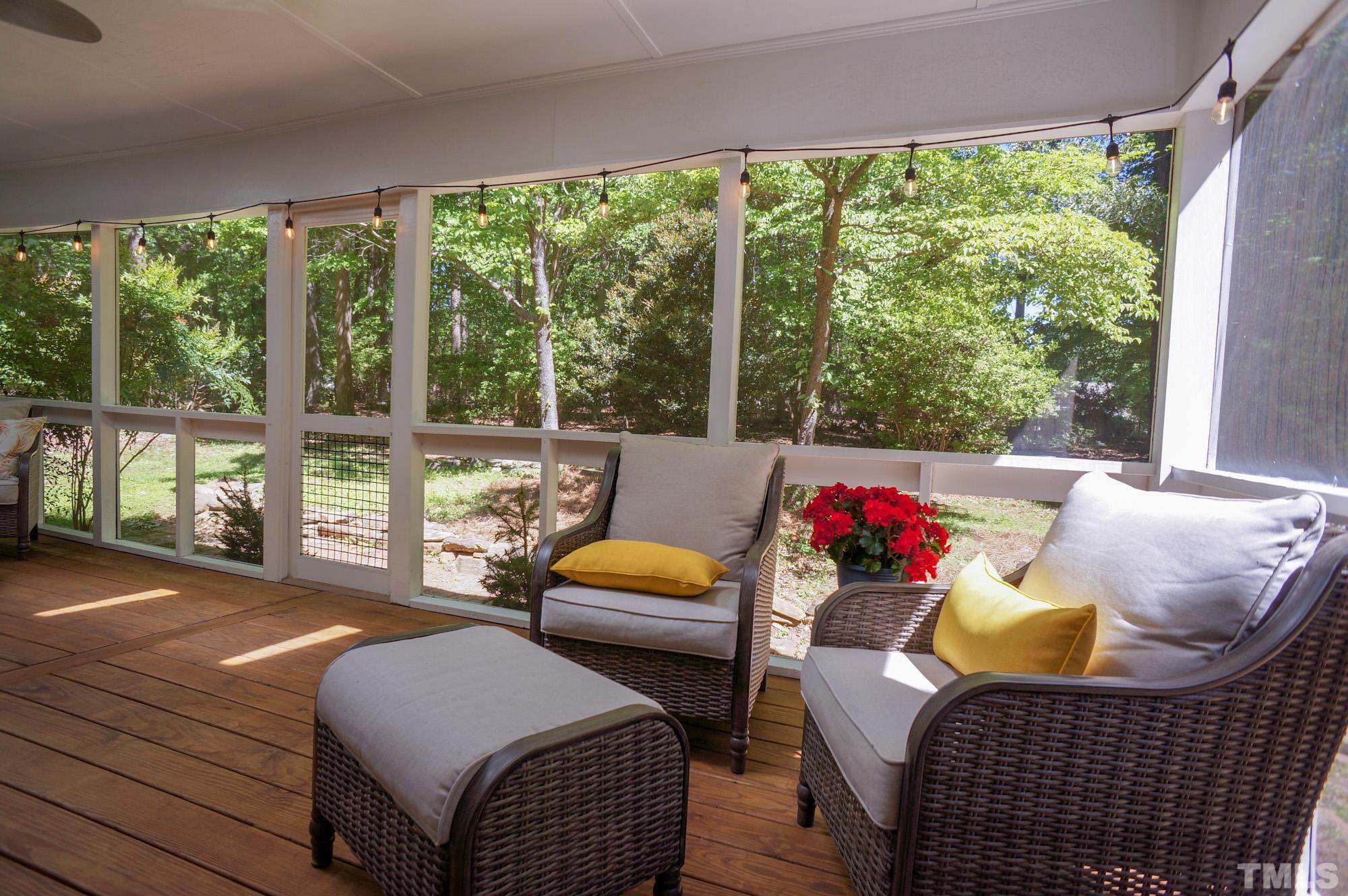 408 Emerywood Drive Raleigh, NC 27615 - Photo 38 of 44 a living room with furniture and a floor to ceiling window