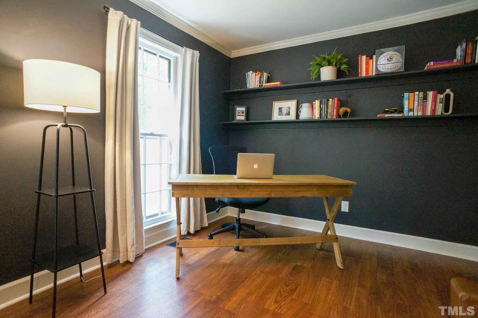 408 Emerywood Drive Raleigh, NC 27615 - Photo 4 of 44 a view of a workspace with furniture and a window