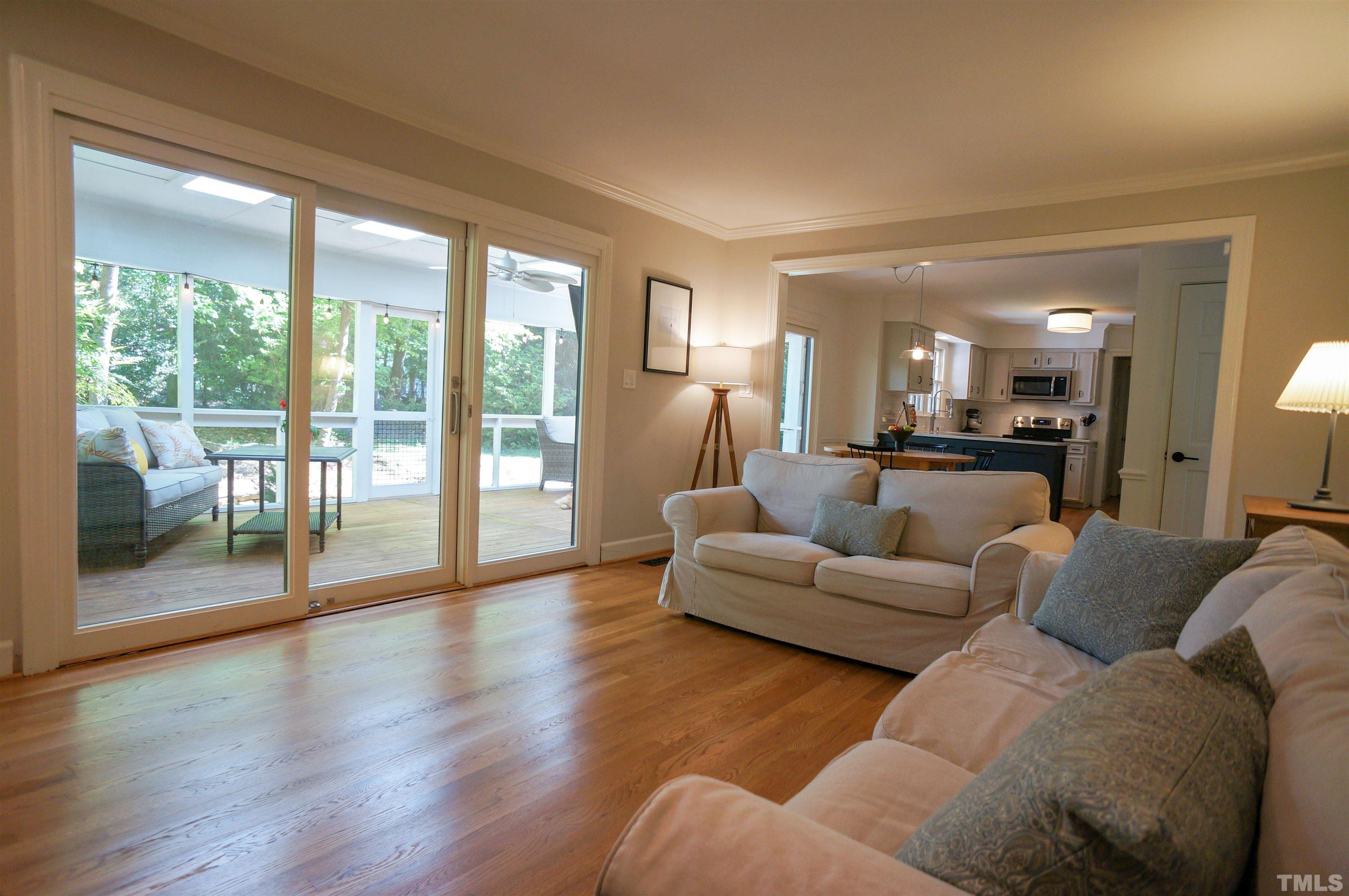 408 Emerywood Drive Raleigh, NC 27615 - Photo 8 of 44 a living room with furniture and a large window