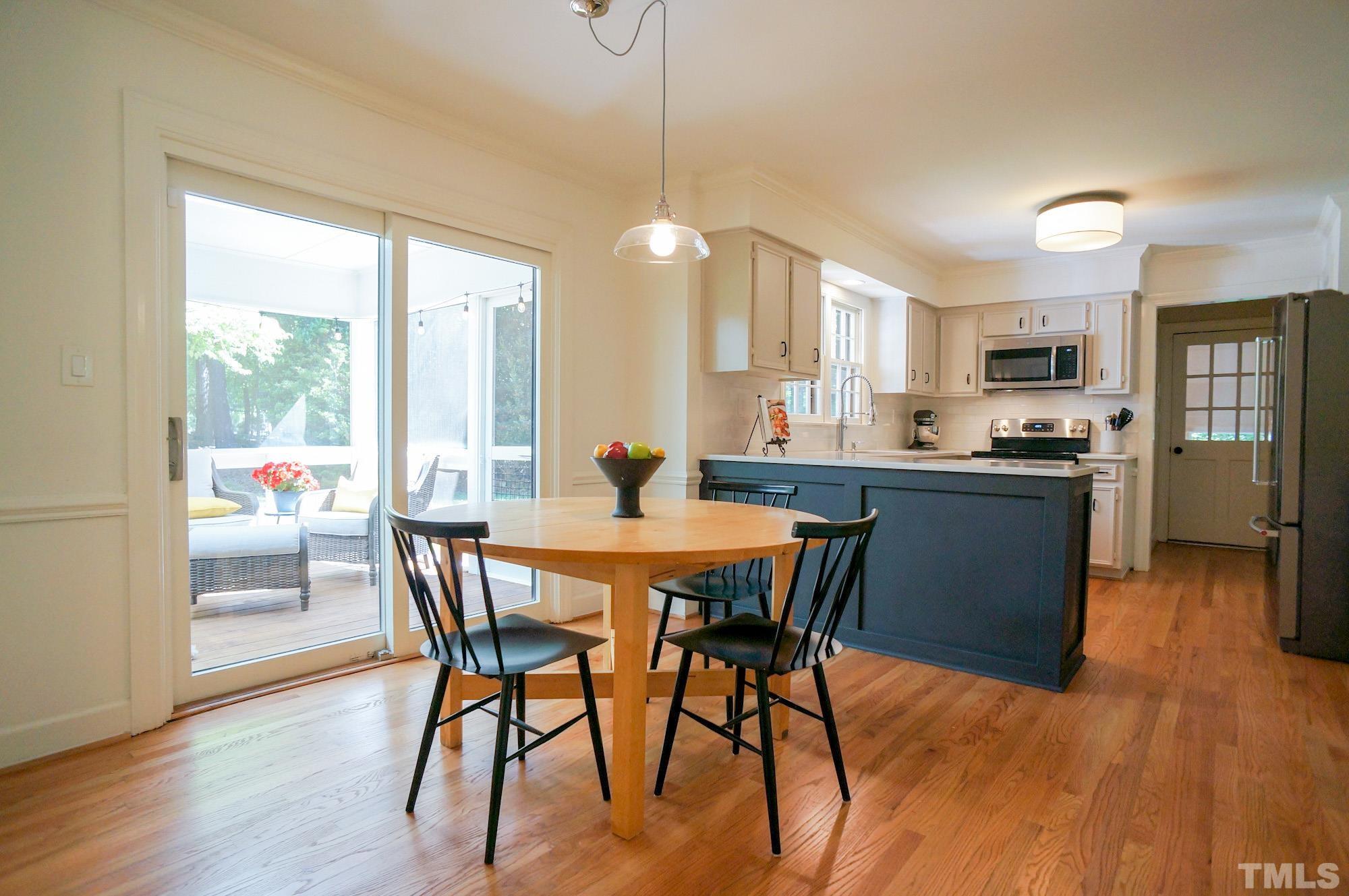 408 Emerywood Drive Raleigh, NC 27615 - Photo 10 of 44 a dining room with furniture and wooden floor