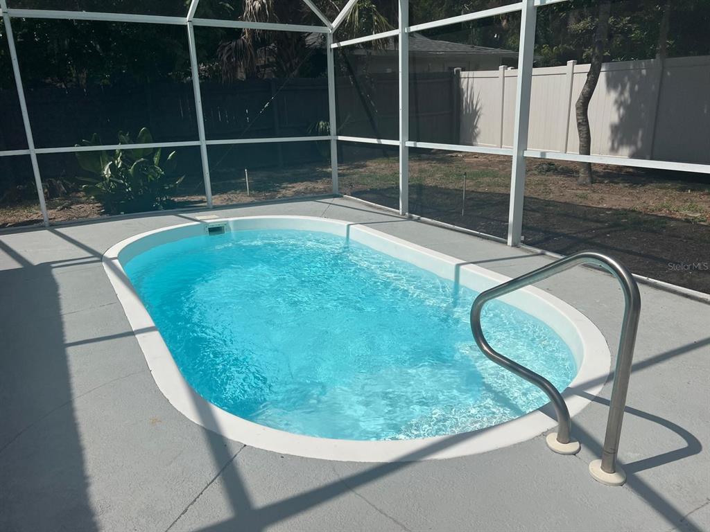 905 West 11th Avenue Mount Dora, FL 32757 - Photo 24 of 25 a view of a swimming pool with a chair