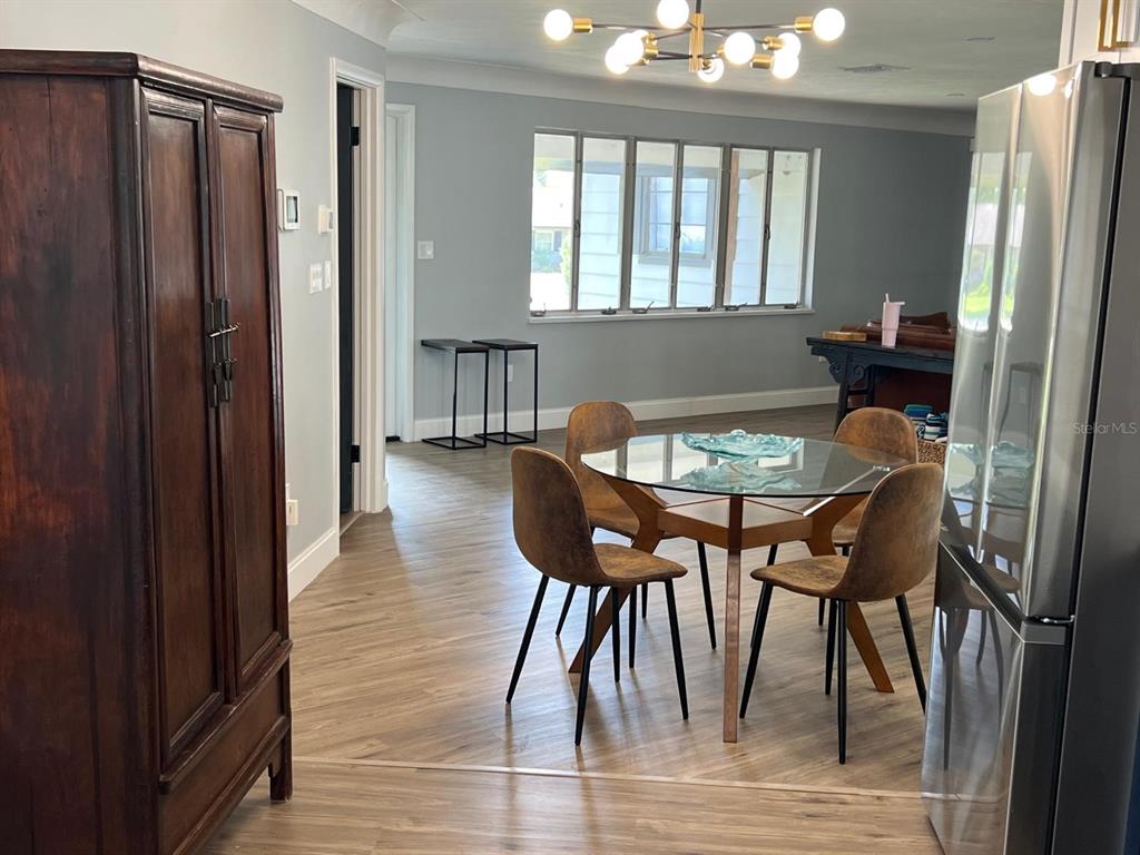 905 West 11th Avenue Mount Dora, FL 32757 - Photo 10 of 25 a view of a dining room with furniture and window