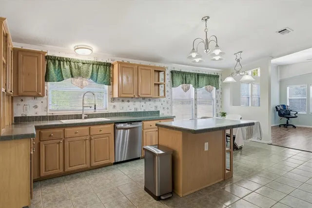 a view of a livingroom with wooden floor and a fireplace