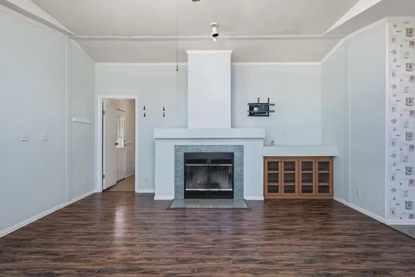 a view of a livingroom with workspace and a window