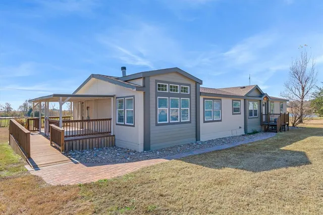 a view of a kitchen with a sink and a refrigerator