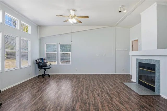 a large kitchen with stainless steel appliances kitchen island granite countertop a large counter top and a stove