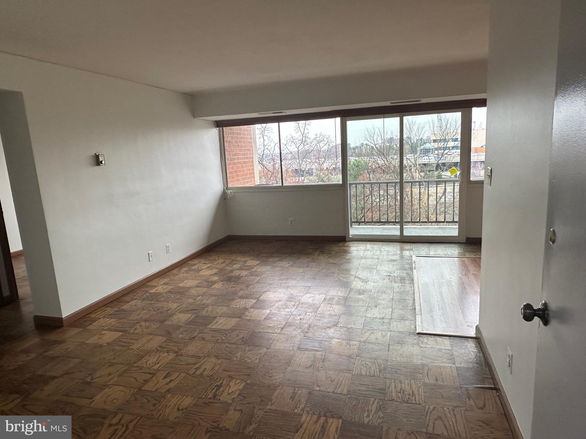 5801 Quantrell Avenue, Unit 407 Alexandria, VA 22312 - Photo 13 of 14 a view of an empty room with a window