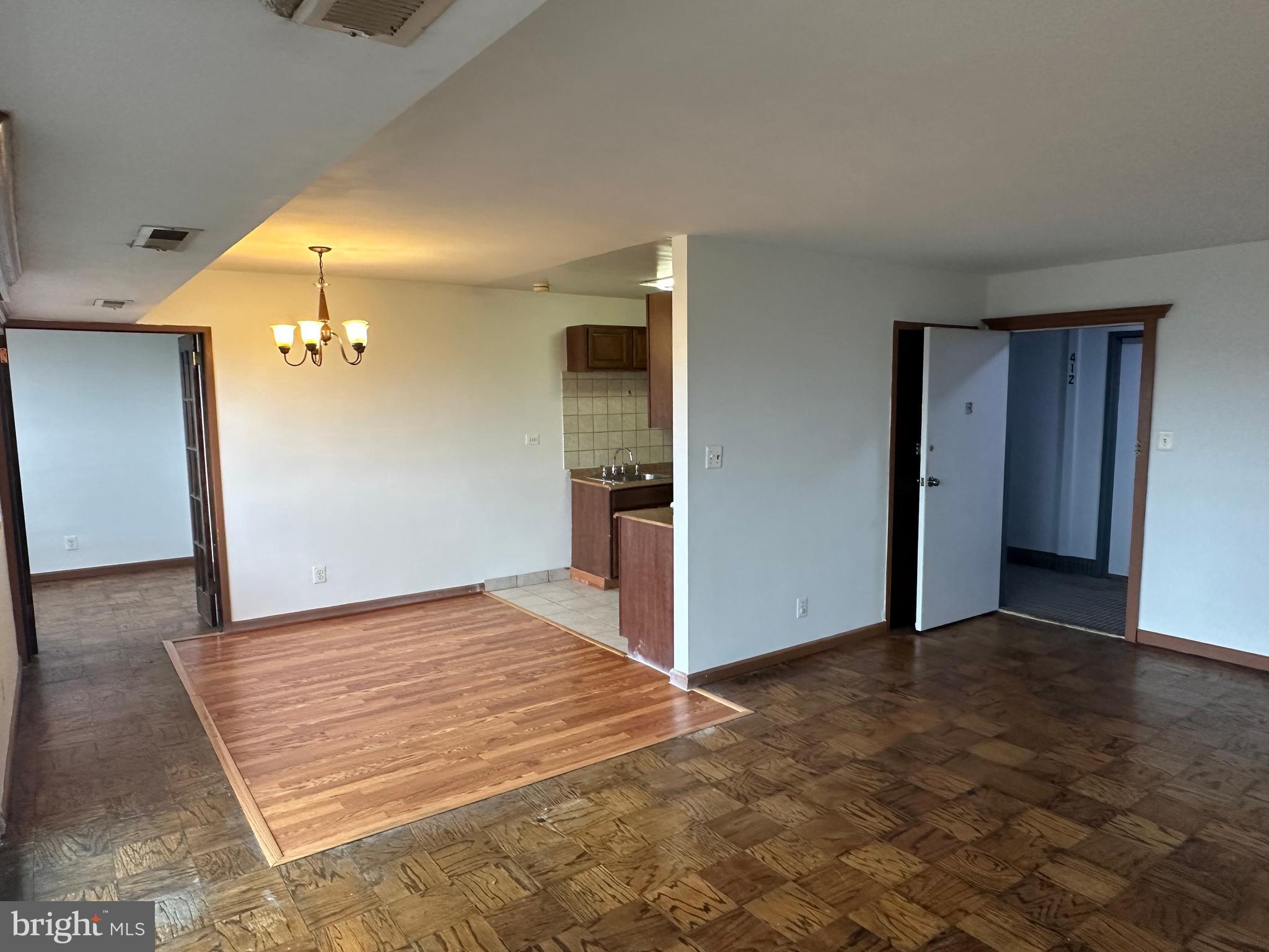 5801 Quantrell Avenue, Unit 407 Alexandria, VA 22312 - Photo 14 of 14 wooden floor in an empty room