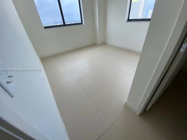 an empty room with windows