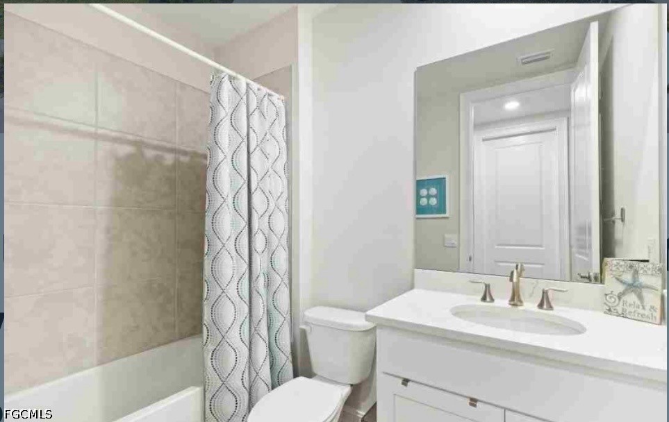 17799 Oleander Avenue Punta Gorda, FL 33982 - Photo 11 of 19 a bathroom with a sink a toilet and shower