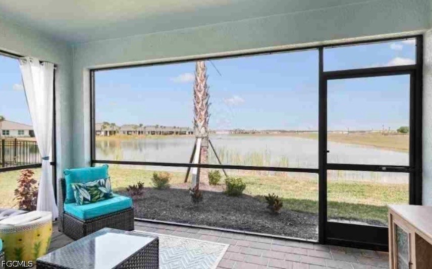 17799 Oleander Avenue Punta Gorda, FL 33982 - Photo 12 of 19 a living room with a large window and a table