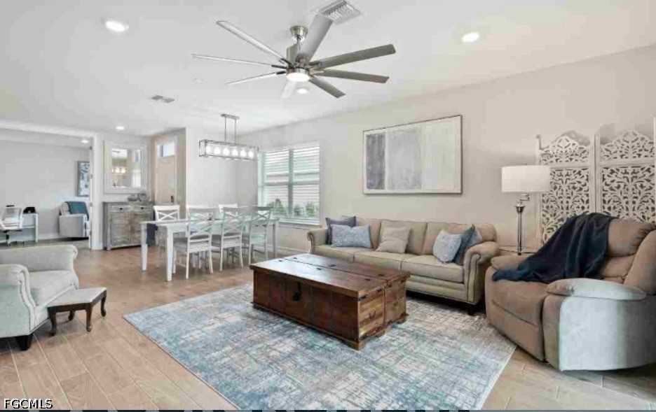 17799 Oleander Avenue Punta Gorda, FL 33982 - Photo 4 of 19 a living room with furniture and view of kitchen