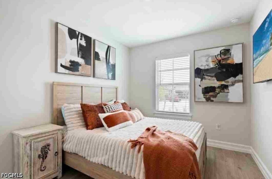 17799 Oleander Avenue Punta Gorda, FL 33982 - Photo 8 of 19 a bed room with a bed and a window