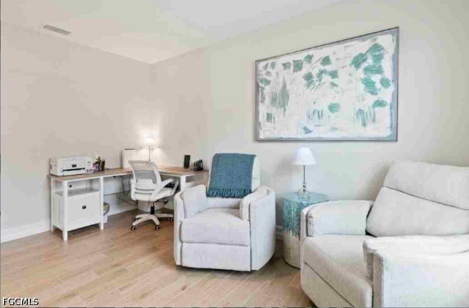 17799 Oleander Avenue Punta Gorda, FL 33982 - Photo 9 of 19 a living room with furniture and wall paintings